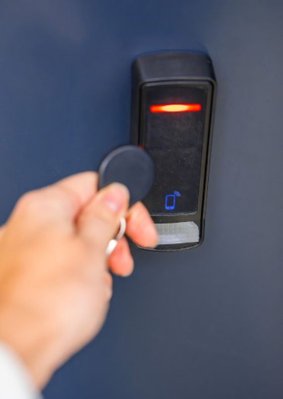Close up view of a person using an electronic door lock
